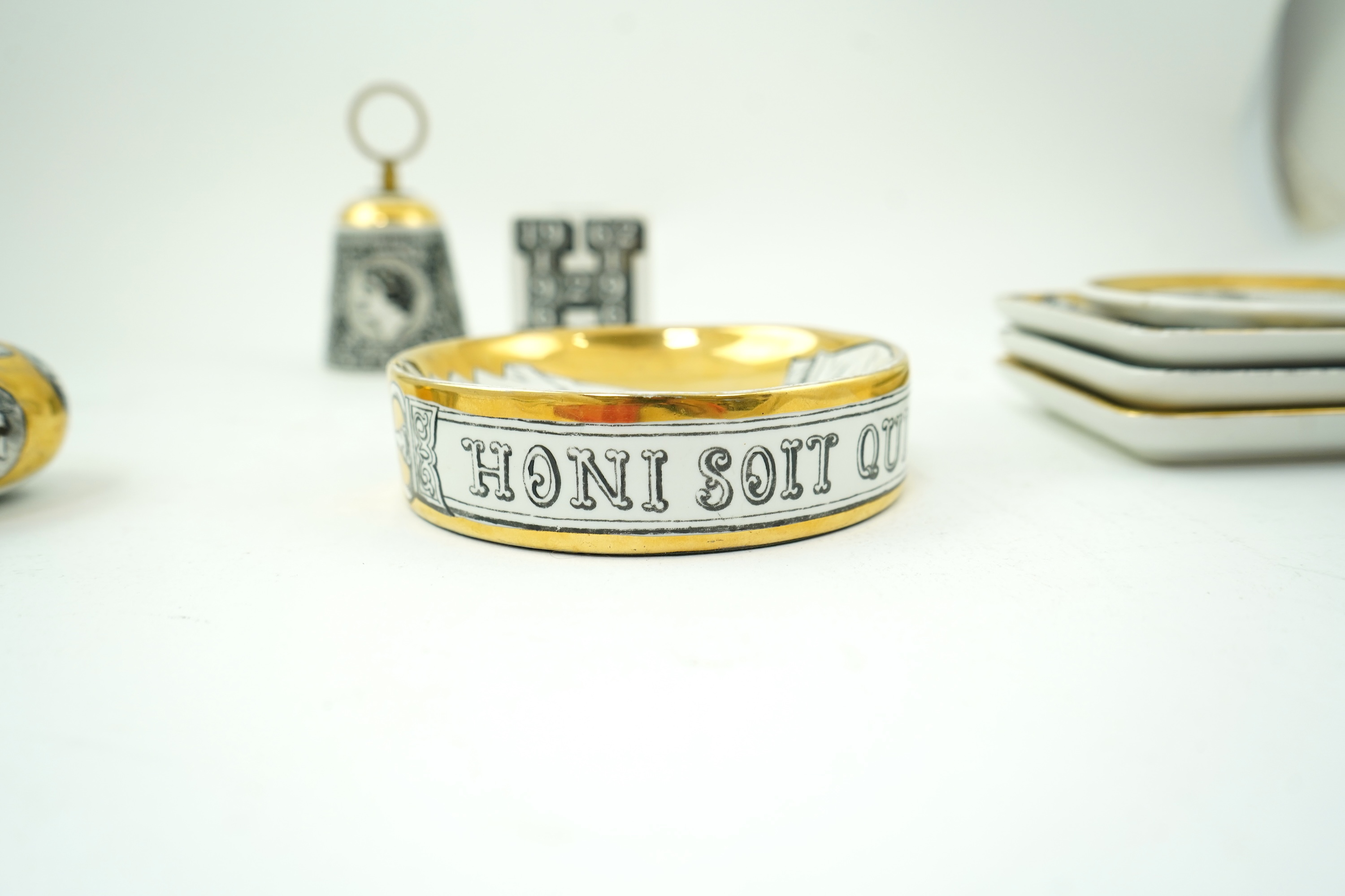 Piero Fornasetti (Italian, 1913-1988): A collection of Fornasetti desk items and dishes
